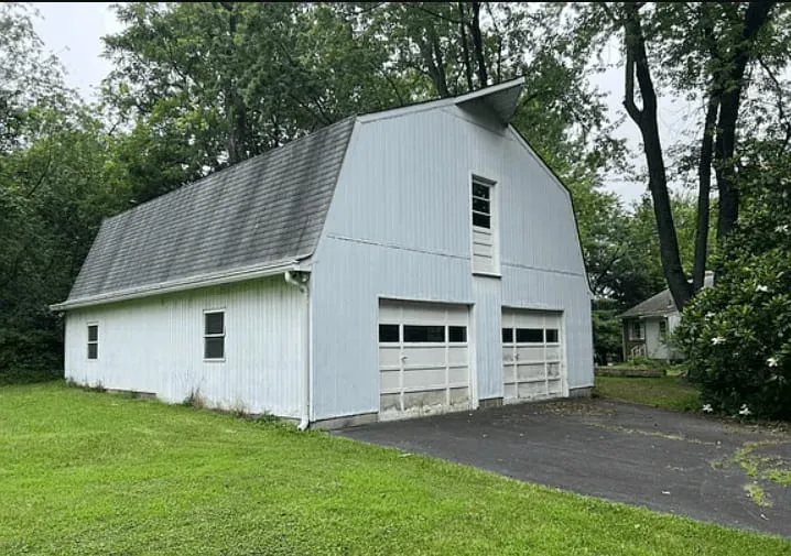 Side view of the purchased Clarksburg property and surrounding grounds.